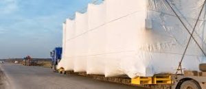 A crated machine arriving at the customers site ready for installation and finally production.