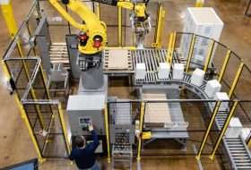Robot in the Palletizing area placing boxes on to the waiting pallets.
